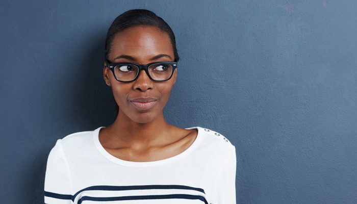 thoughtful woman in glasses