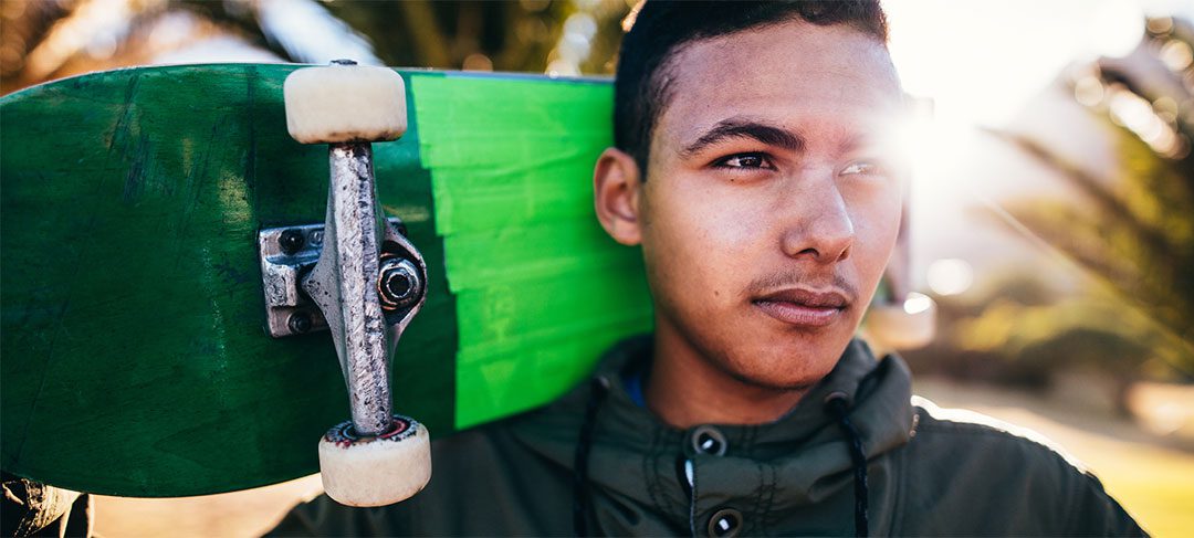 ambitious male with skateboard"